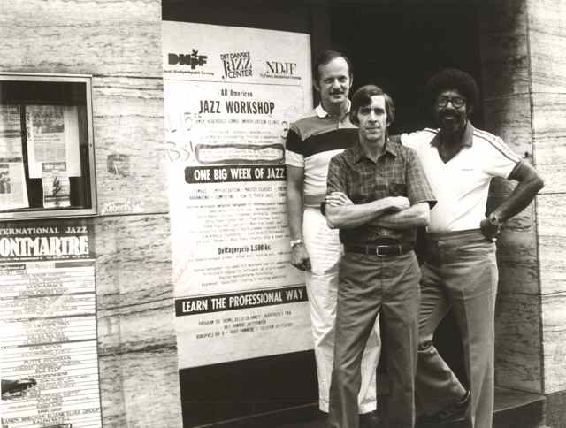 Jamey Aebersold, David Baker, and Jerry Coker, the ABC’s of jazz education stand infront of a sign taht reads "Jazz Workshop"